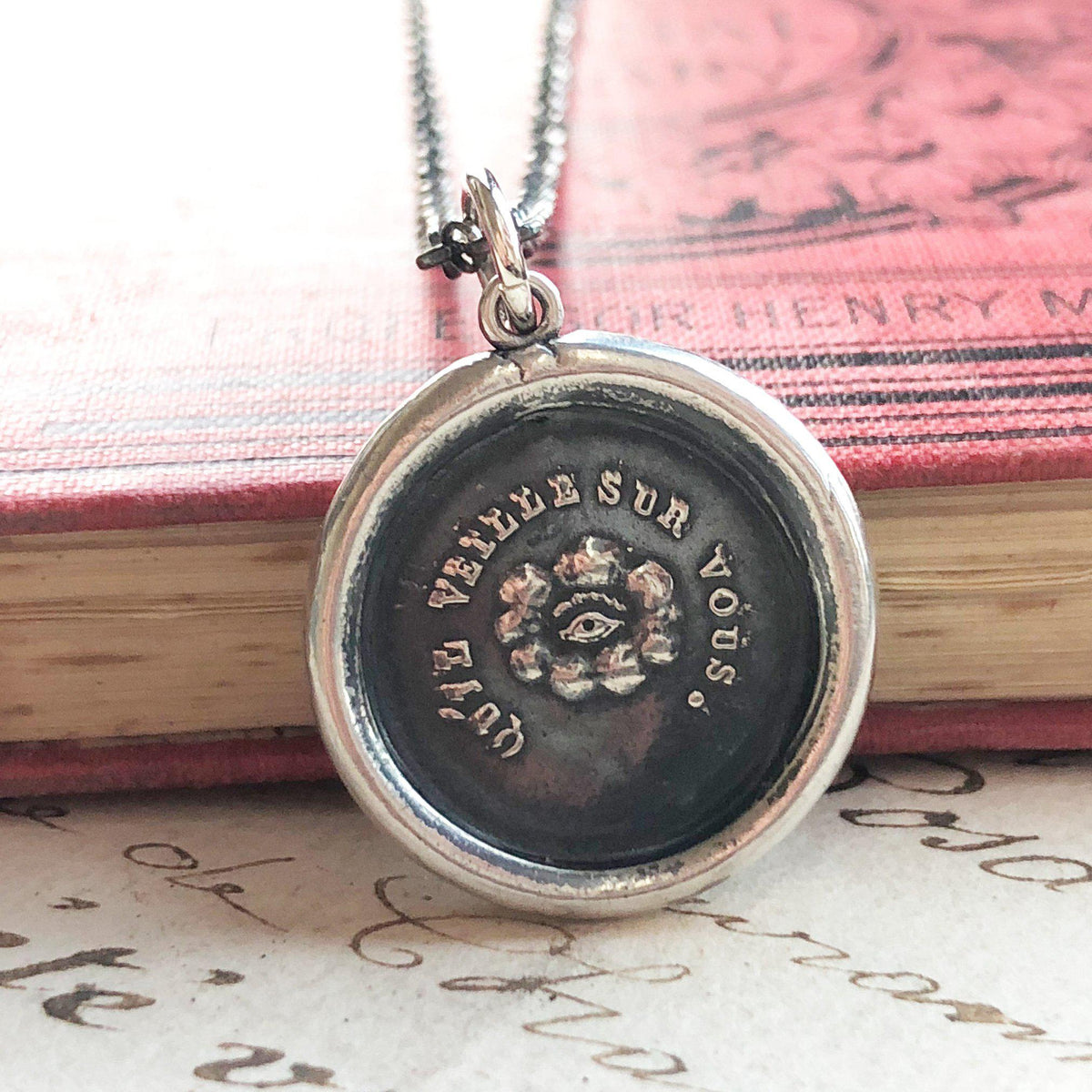 Eye of providence wax seal on a book