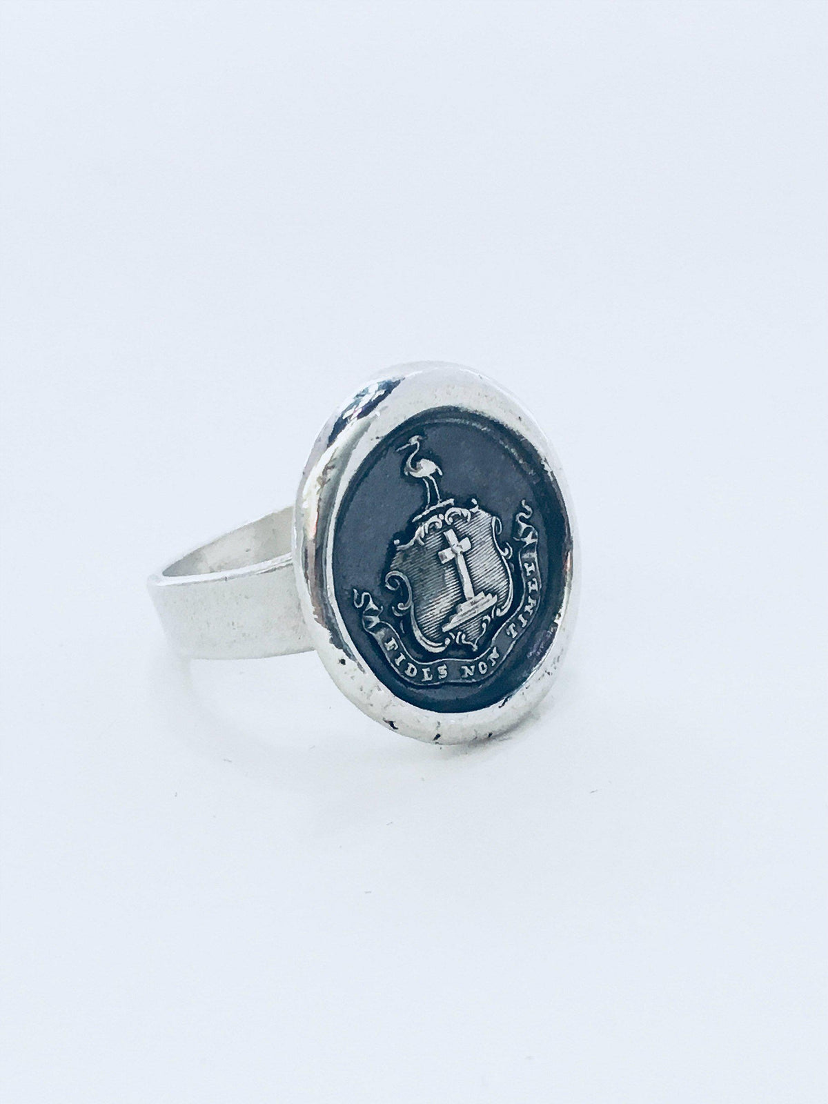 Faith wax seal ring on a white background