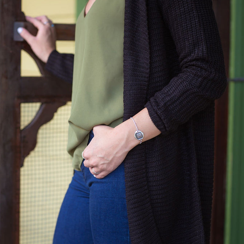 Faithfulness Guides Me Adjustable Wax Seal Bracelet on a model