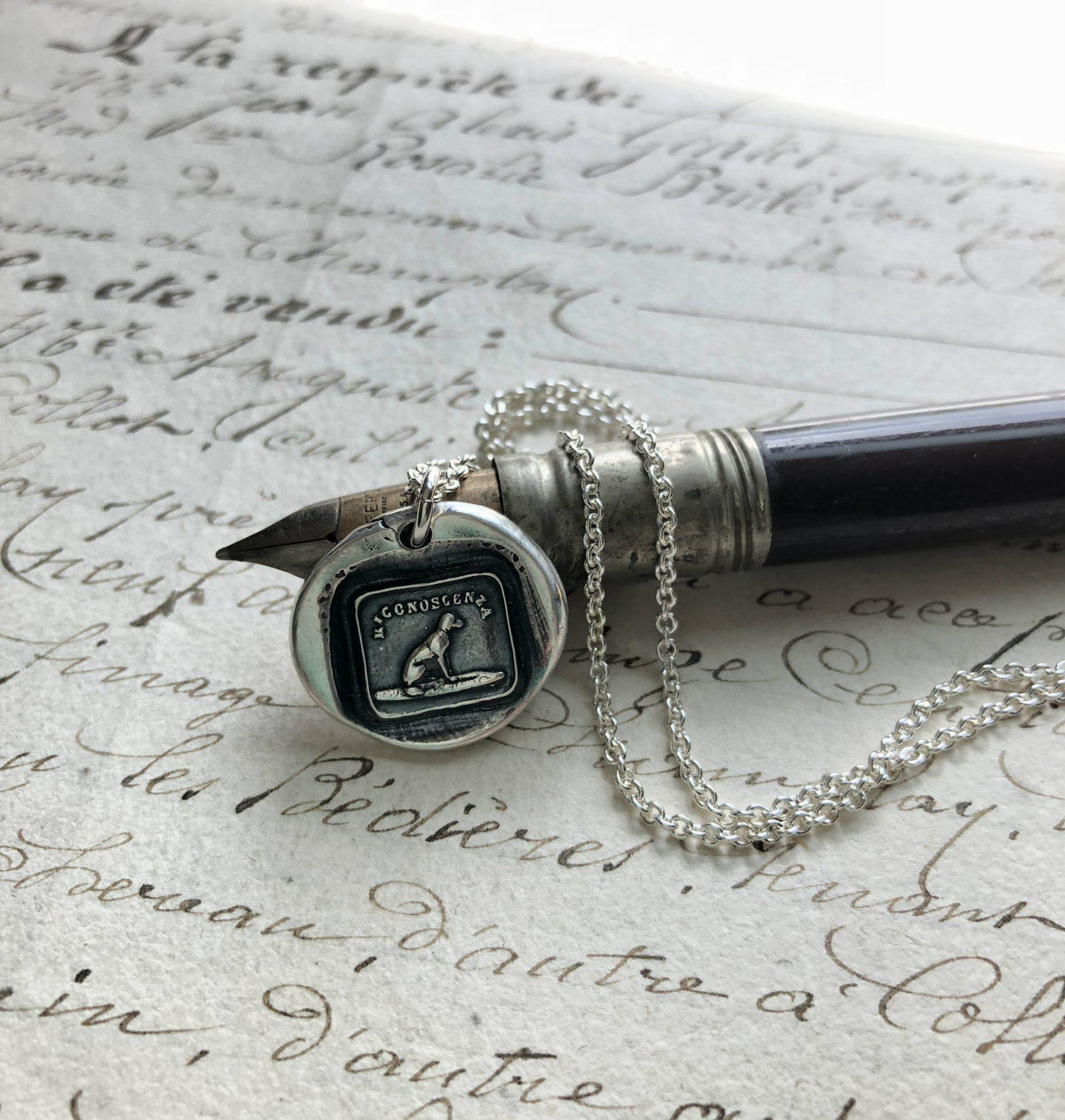 Gratitude dog wax seal charm with a silver chain