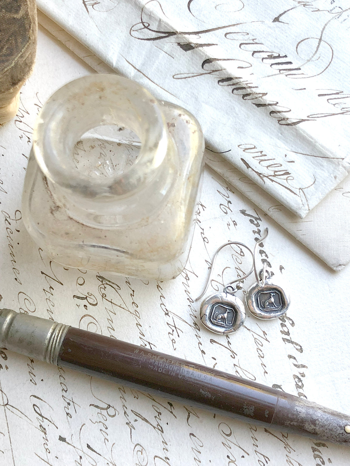 Greyhound wax seal earrings paper