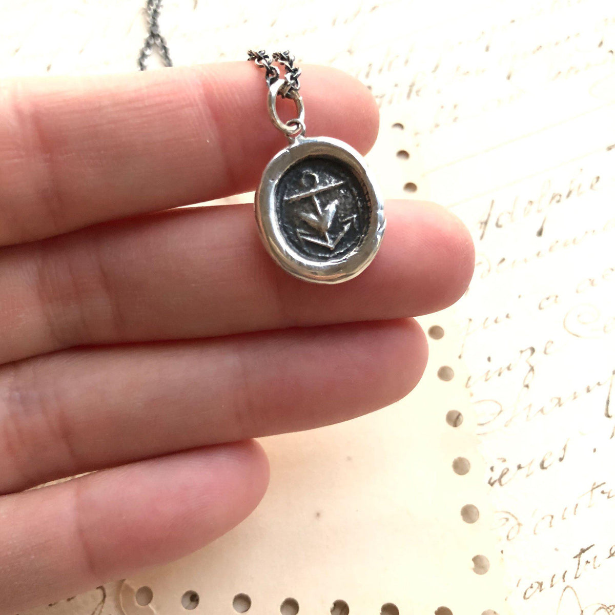 Heart Anchor wax seal over fingers to show size