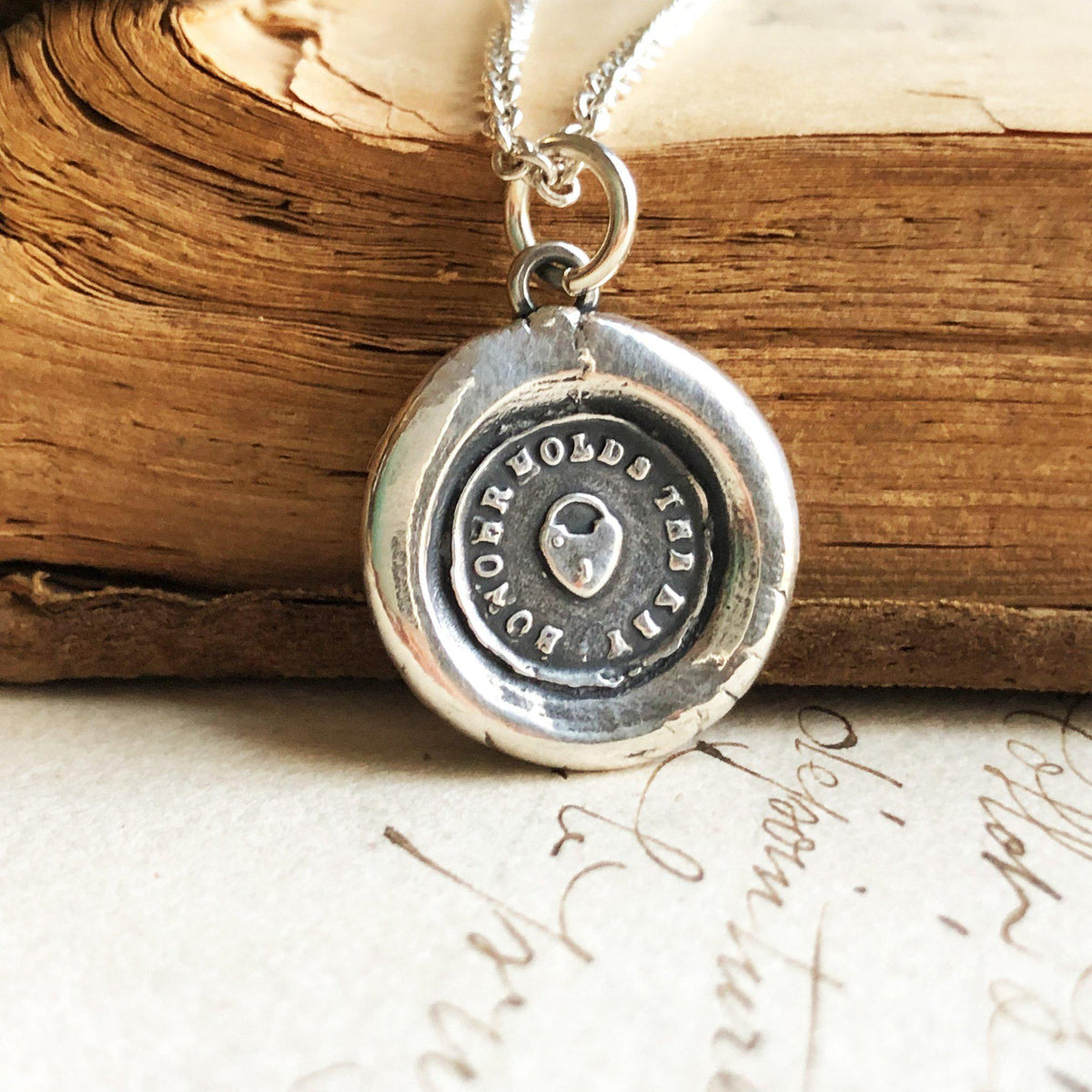 heart padlock wax seal necklace on wood