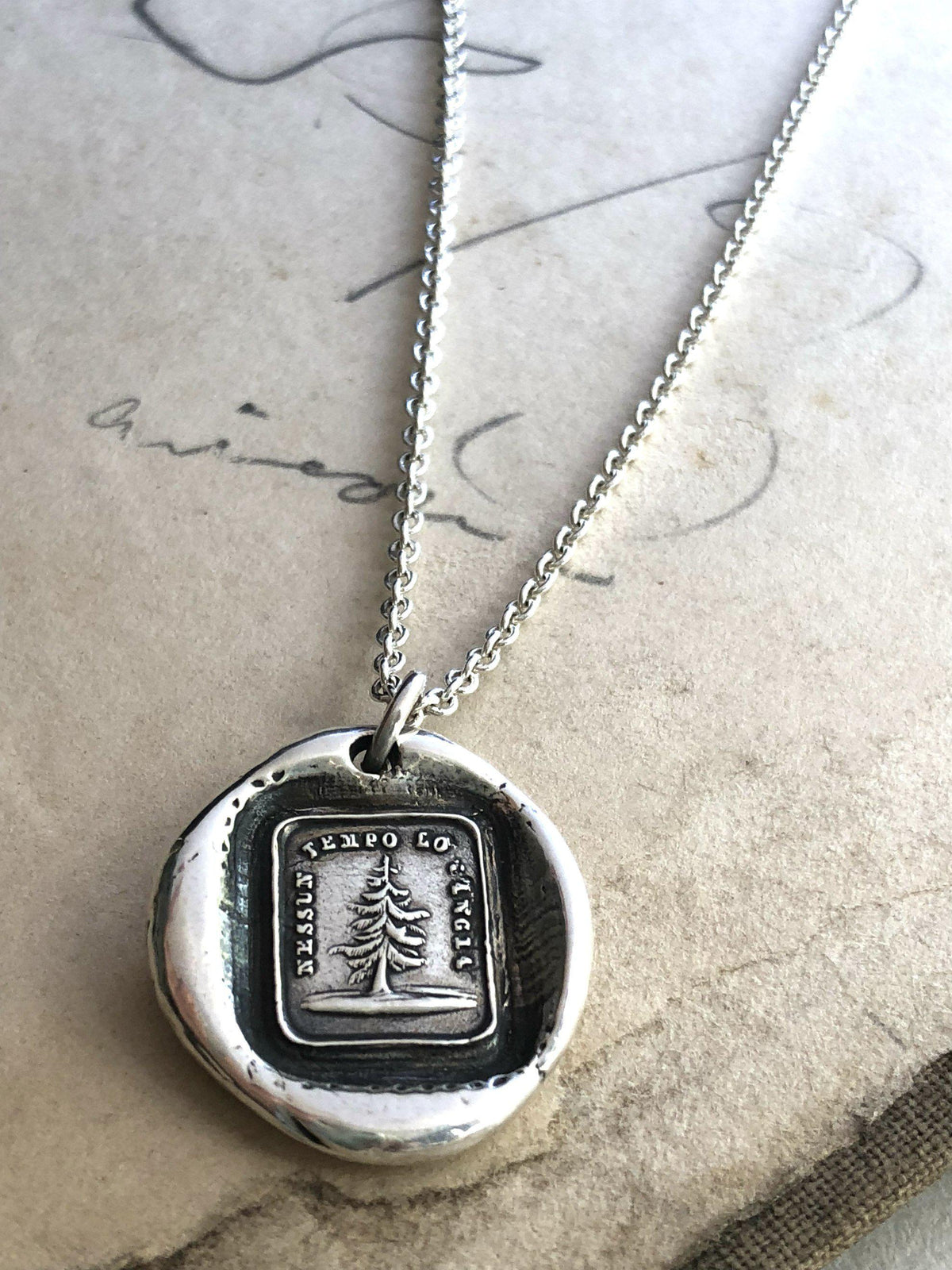 Leaning tree wax seal  on paper