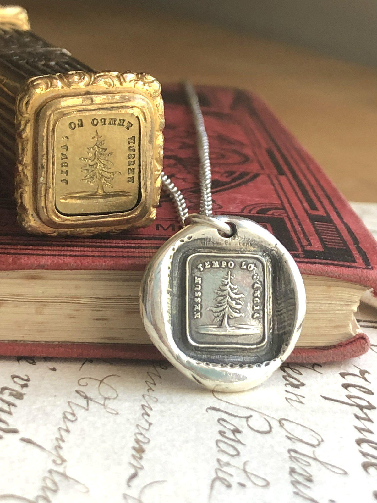 Leaning tree wax seal with chain