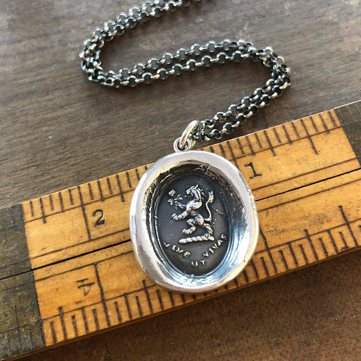 Lion rose wax seal on a ruler
