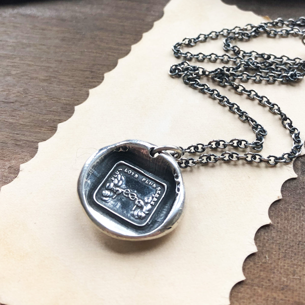 Long distance wax seal necklace on a paper