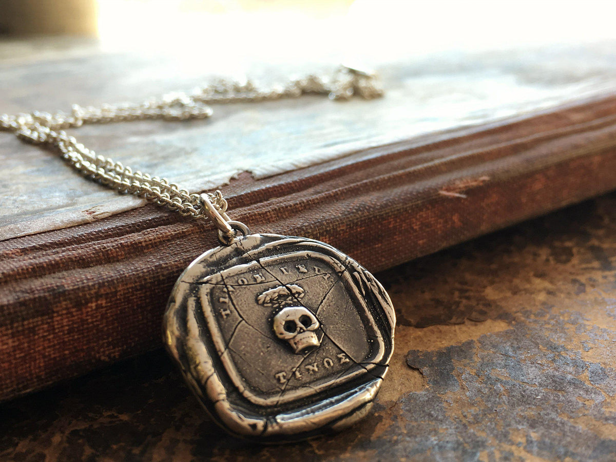 Skull momento mori wax seal on book