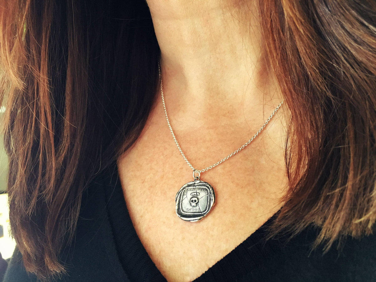 Skull momento mori wax seal on a model