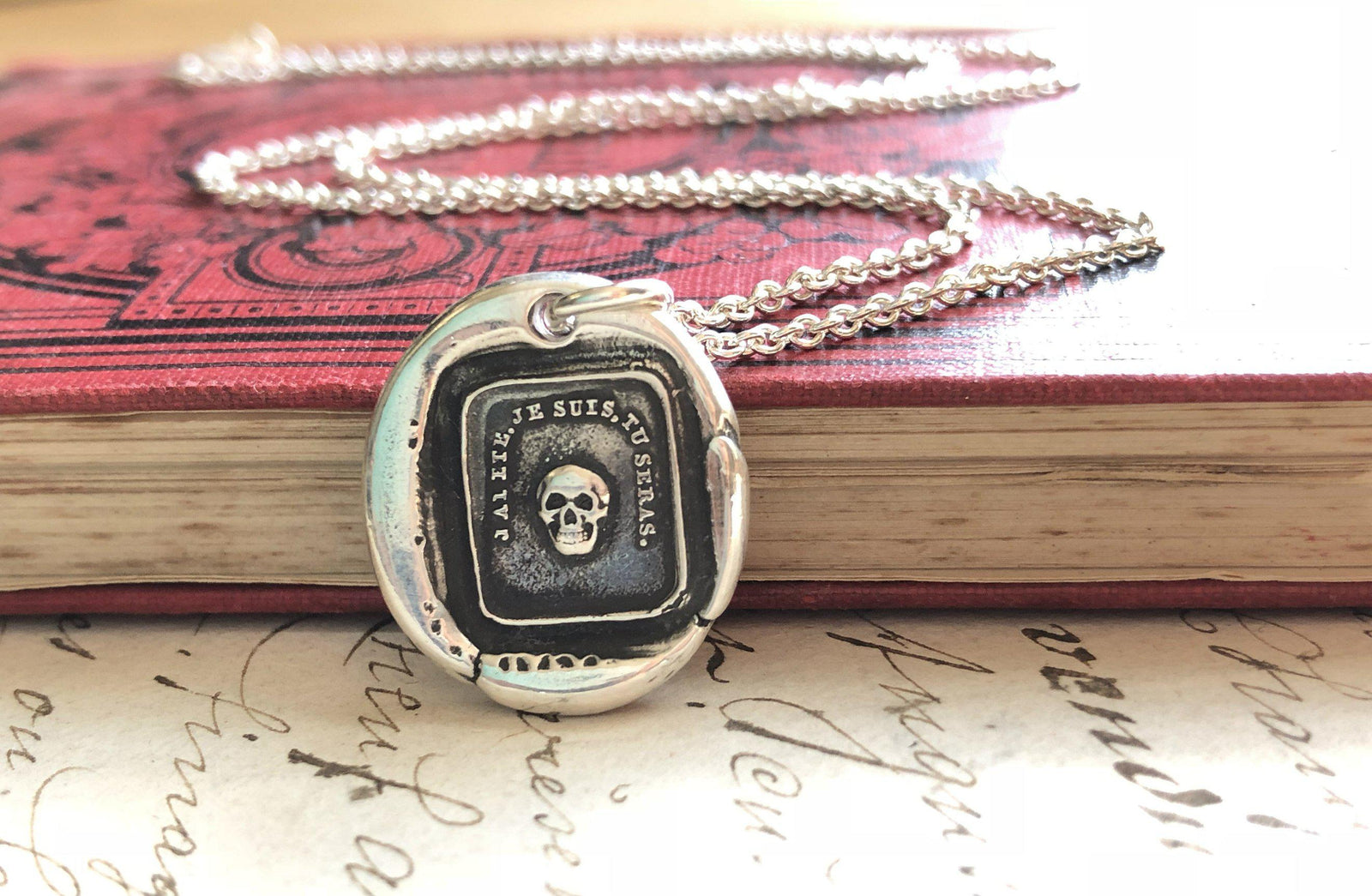 momento skull wax seal necklace