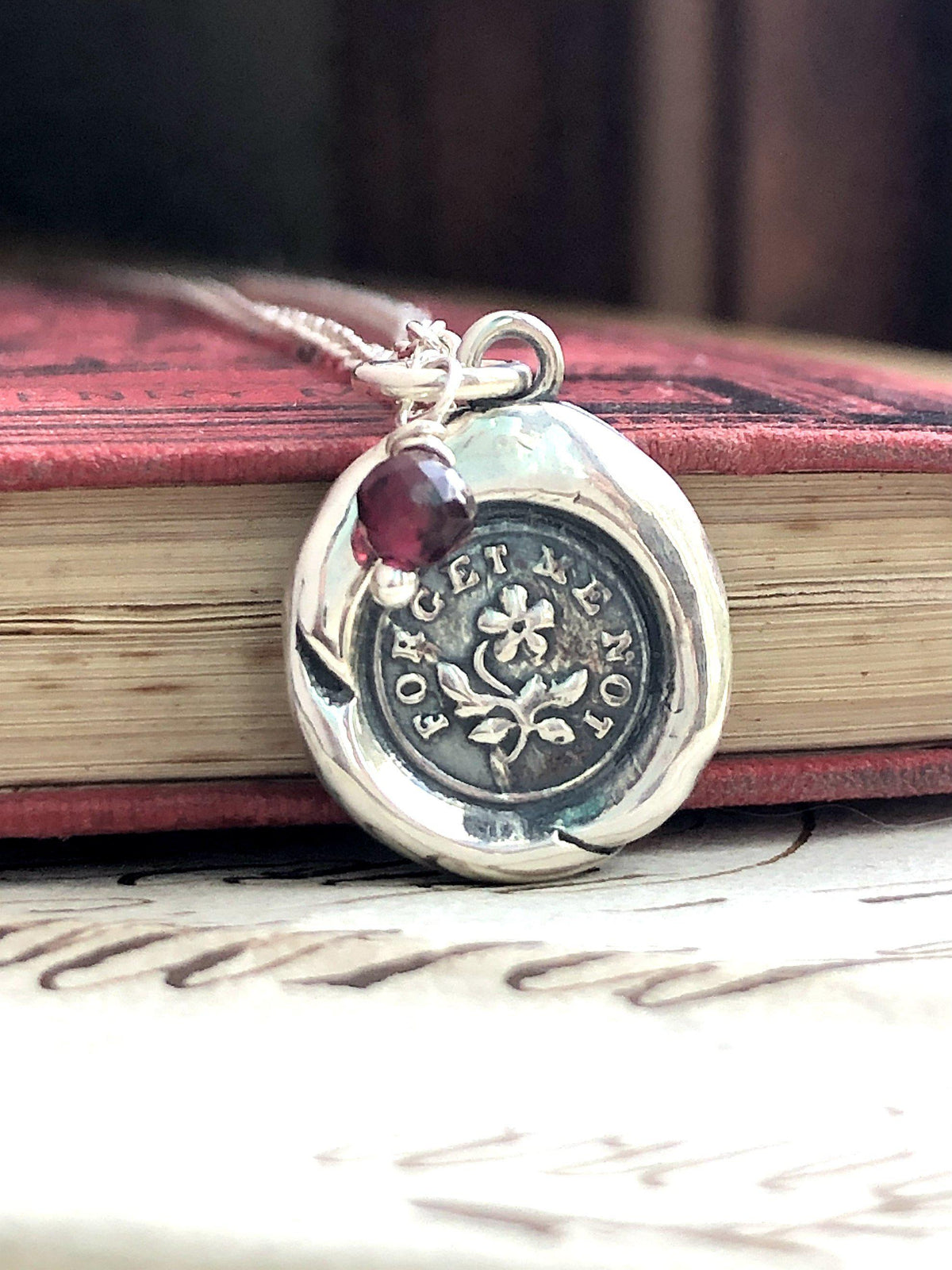 flower forget me not wax seal necklace close