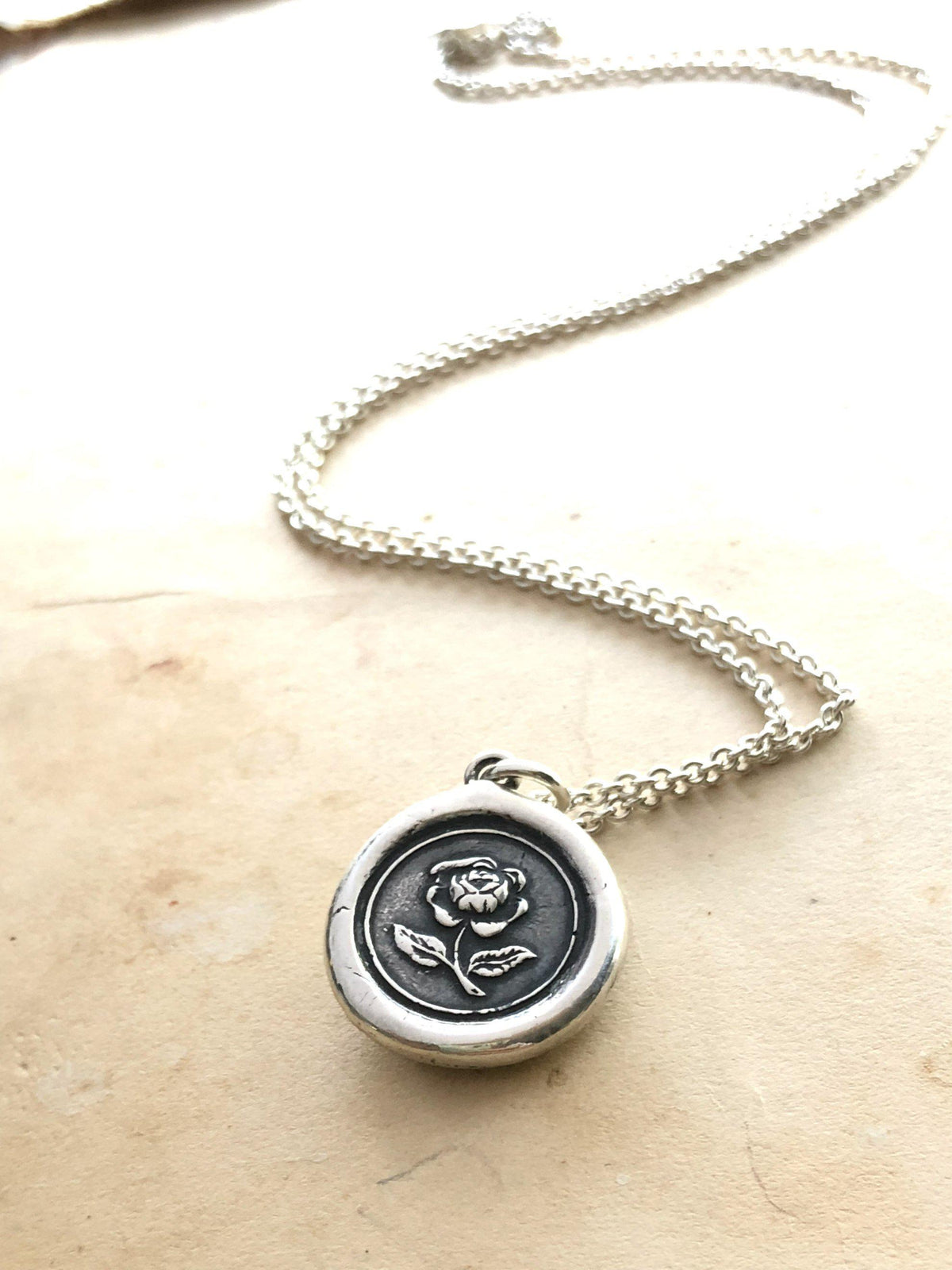 Rose wax seal necklace with a long silver chain