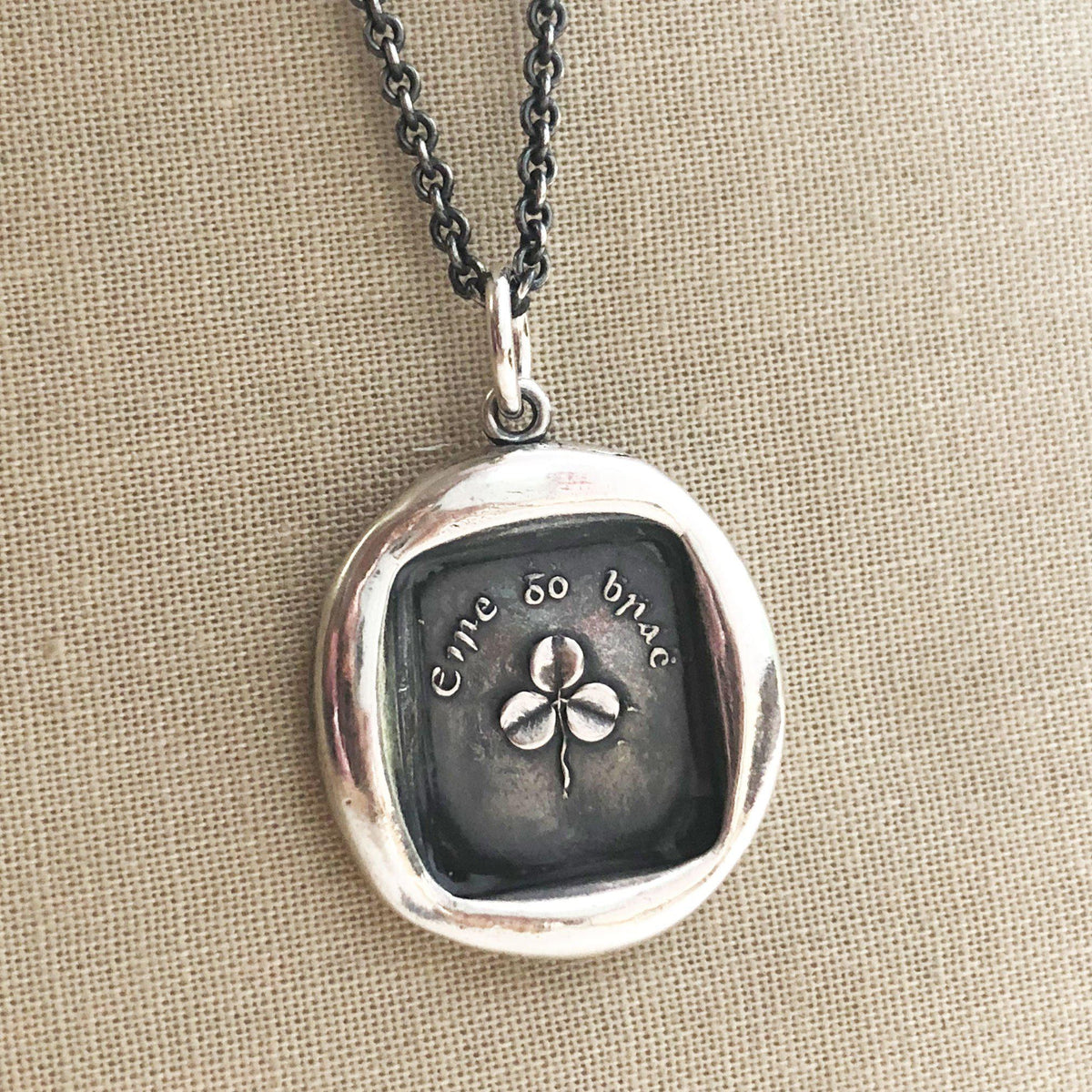 Shamrock wax seal necklace close up