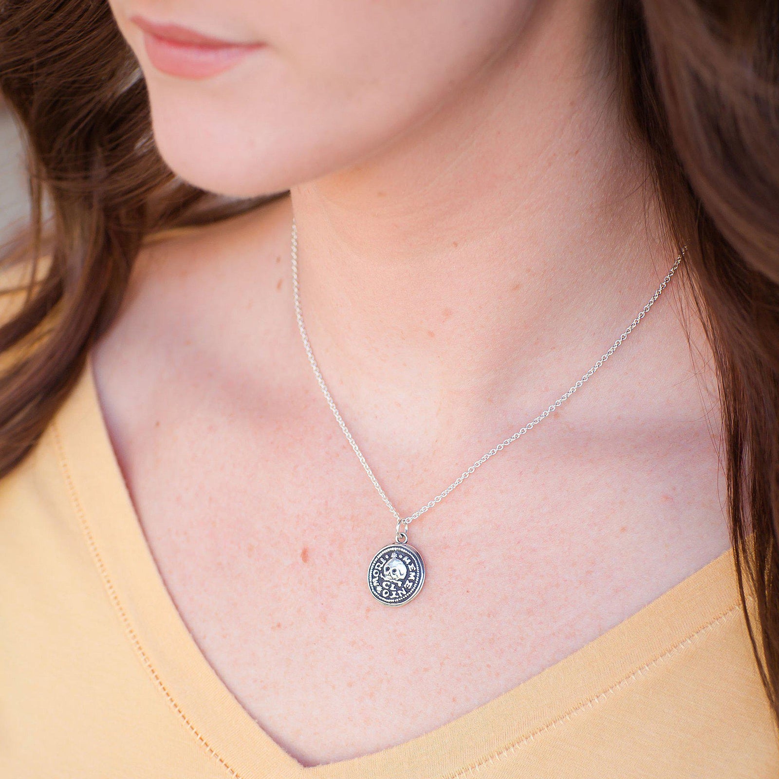 Skull on this wax seal necklace