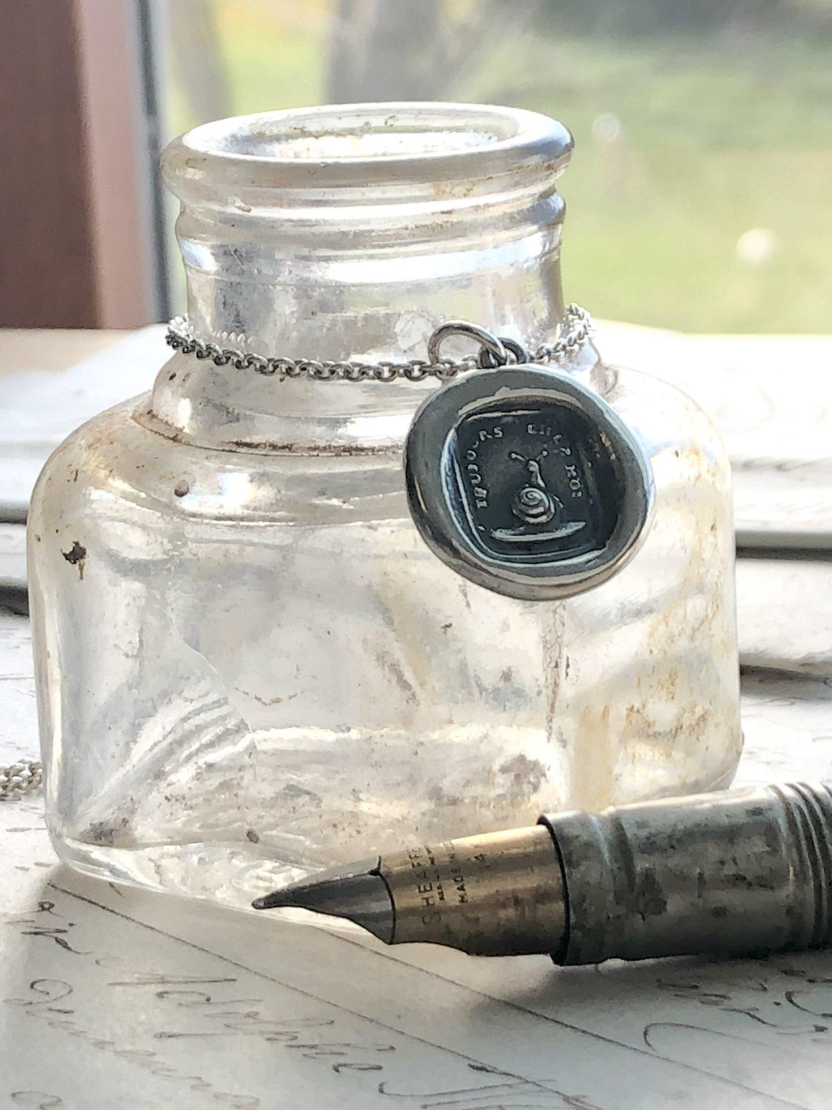 Always with me snail wax seal around a jar