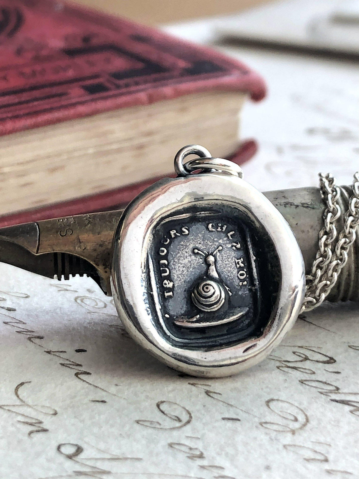 Always with me snail wax seal over a pen