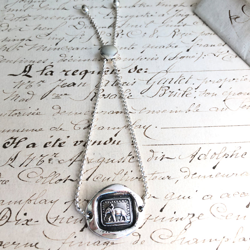 Reason Is My Strength - Adjustable Wax Seal Bracelet on paper