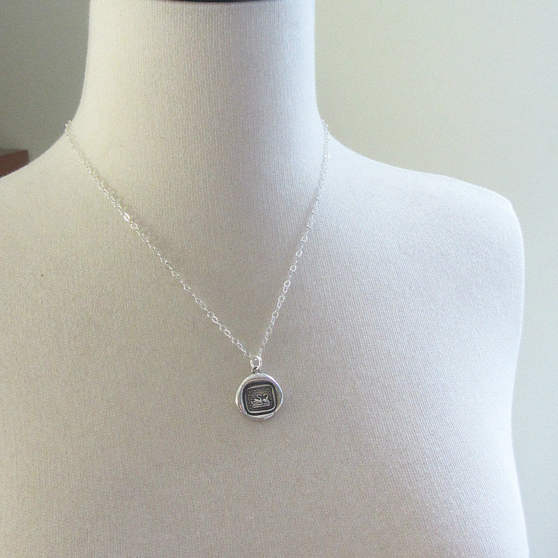 two swans wax seal on a mannequin