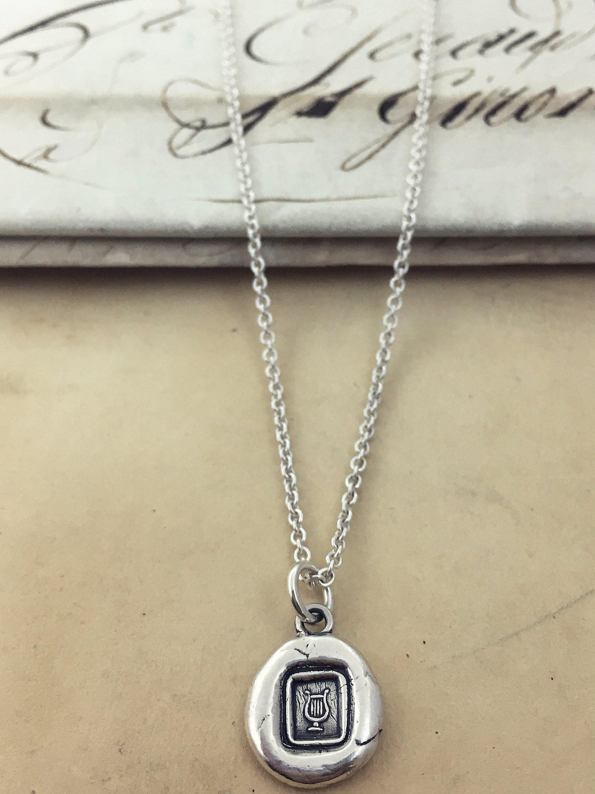 Tiny lyre chain with a silver chain