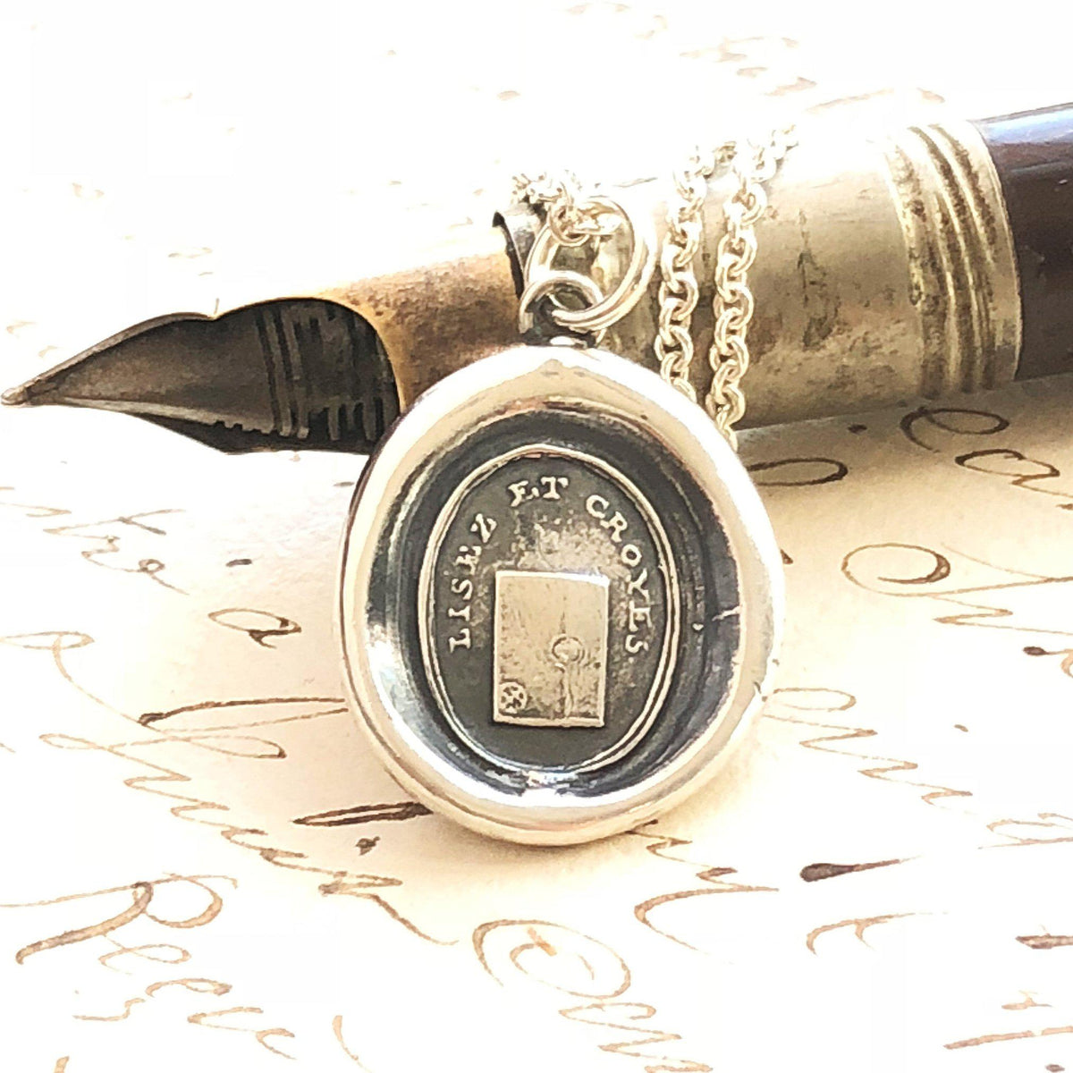 Truth and sincerity wax seal necklace on a pen