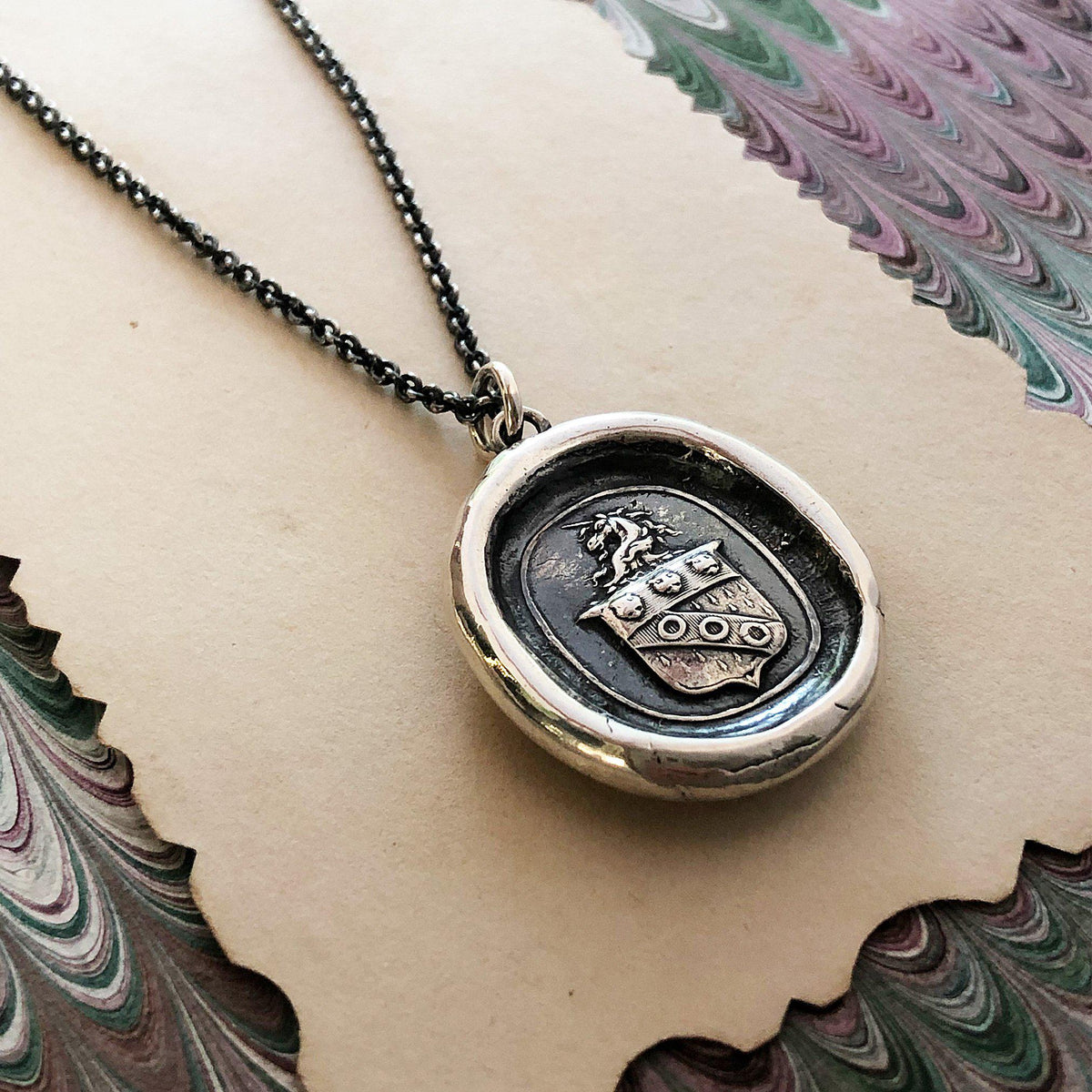 Unicorn crest wax seal necklace close up
