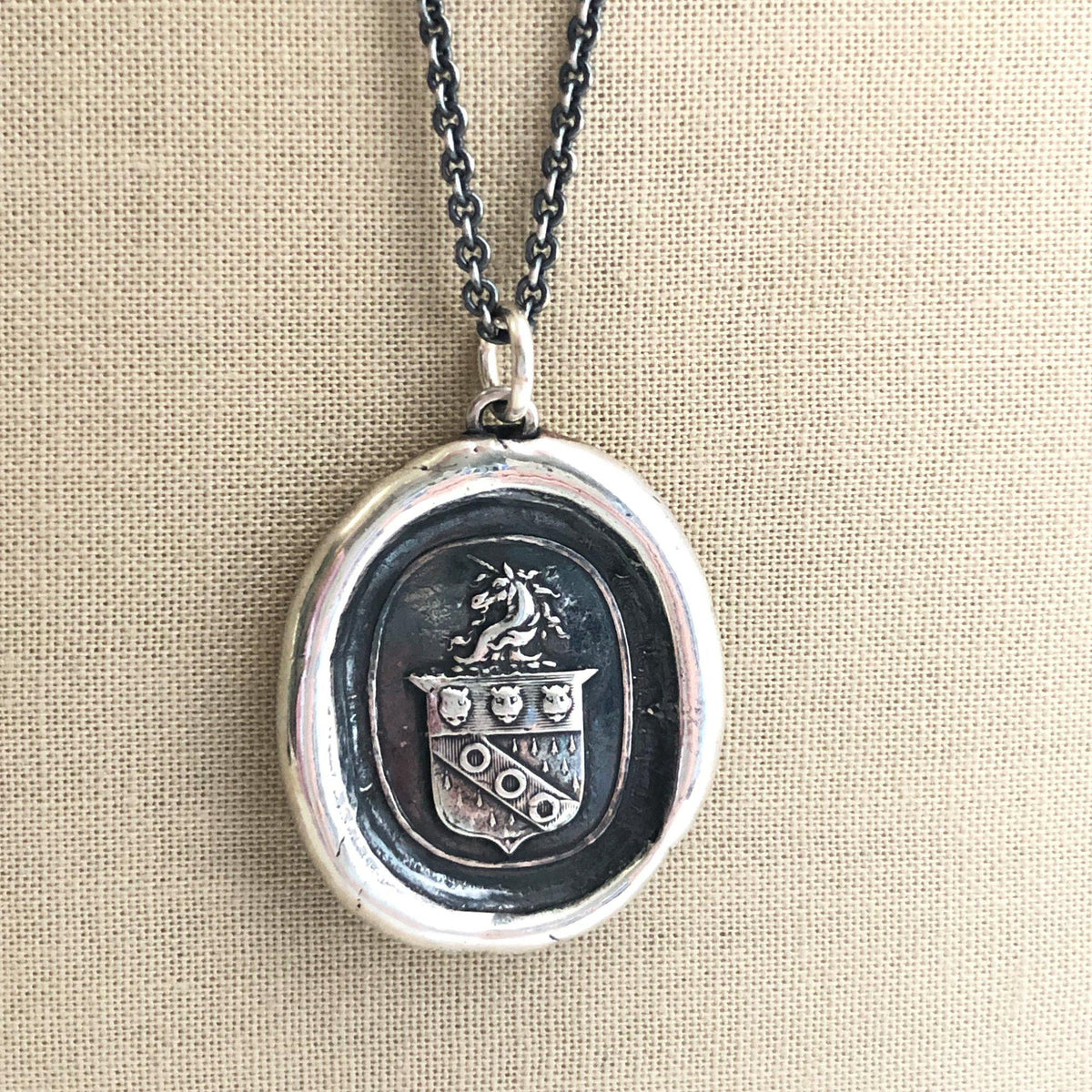 Unicorn crest wax seal necklace hanging