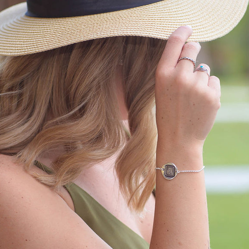 We Part to Meet Again bracelet on a model